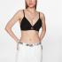Top Tommy Jeans Bralette A Coste Con Distintivo da donna rif. DW0DW15305